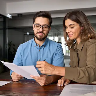 Two specialists looking for signs of solar fraud