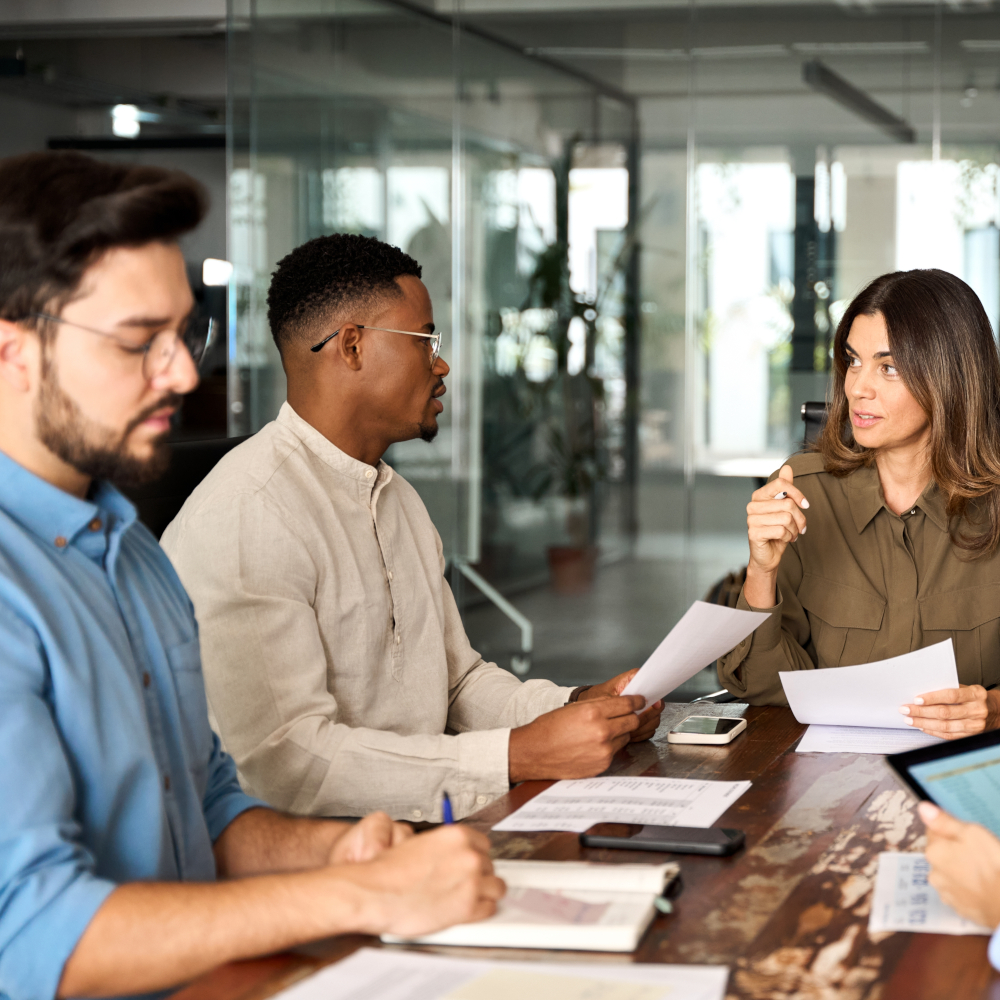 Lawyer and Case Manager Looking over Solar Contracts